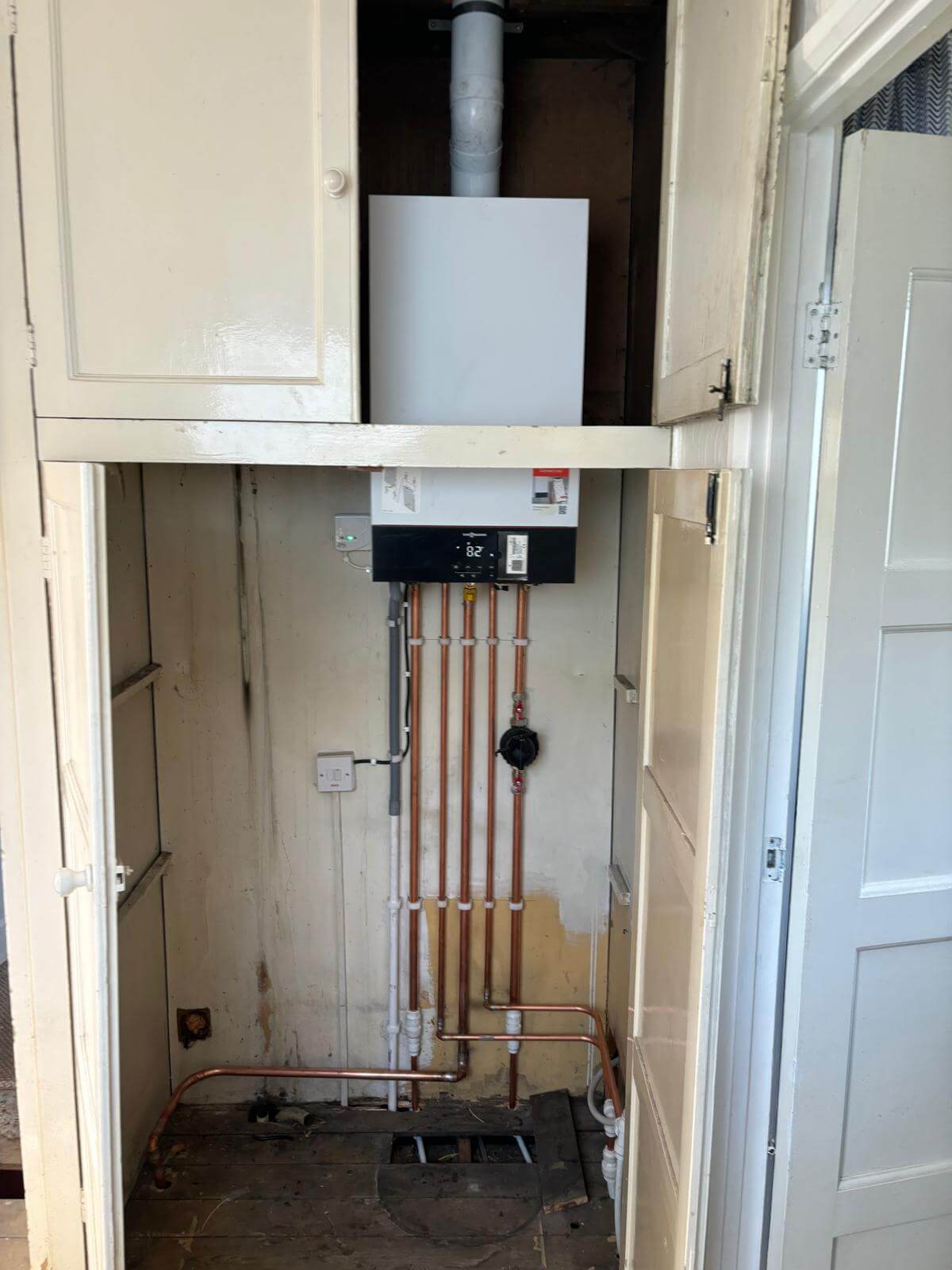 Combi boiler and pipework installed in a cupboard by Ninja Ops, Newcastle
