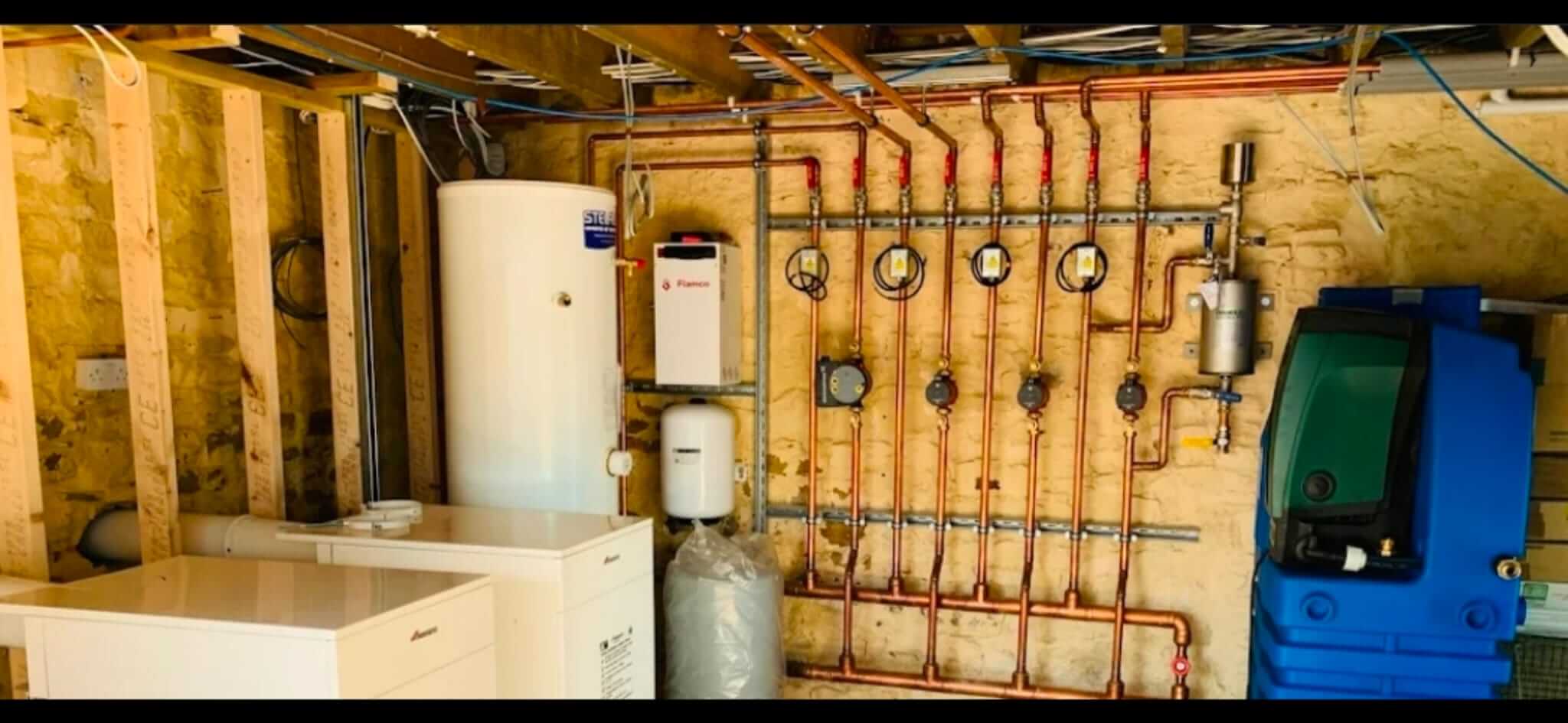 Heating system with hot water cylinder, pumps and controls