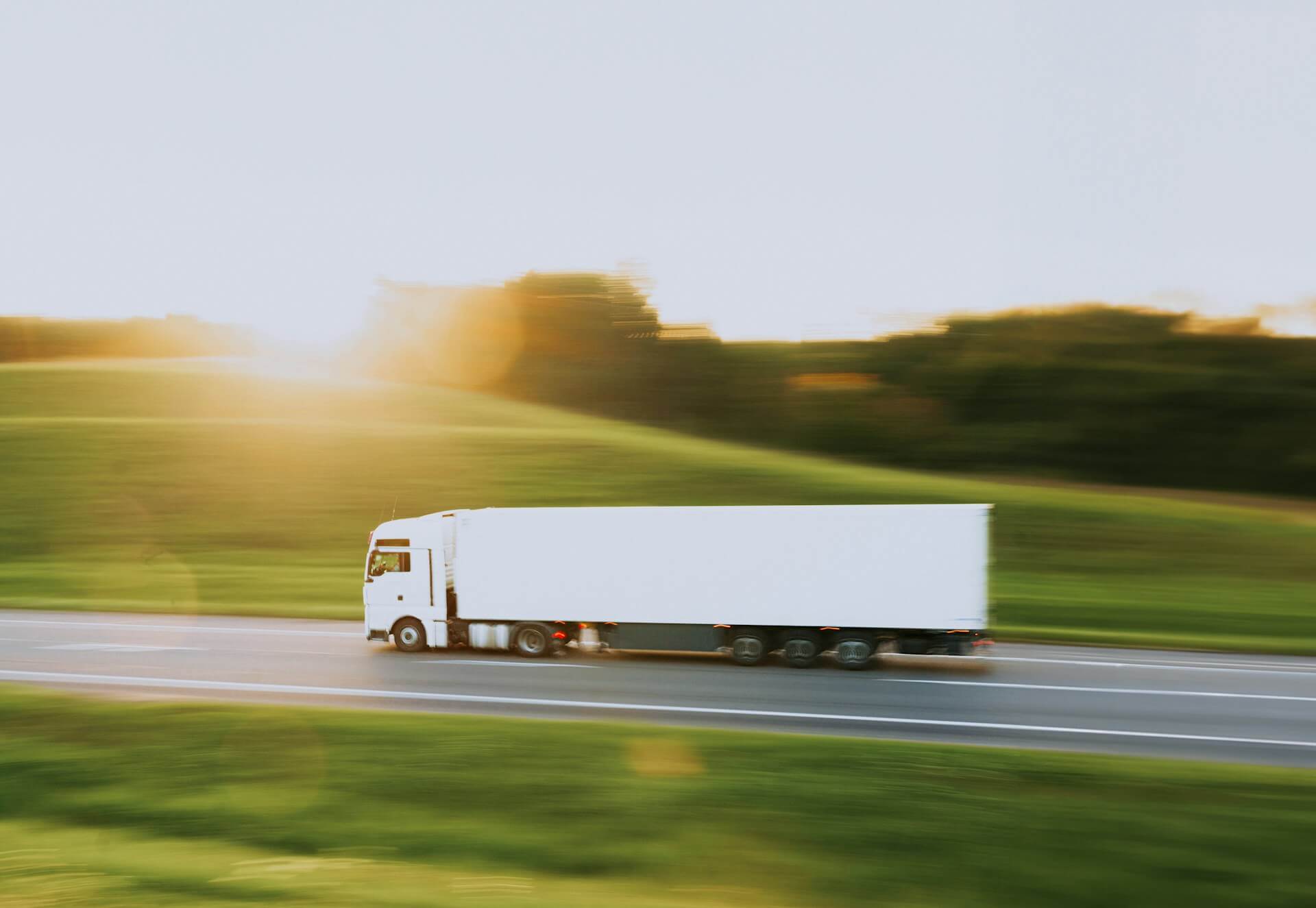 Lorry in motion representing time-critical delivery across Newcastle